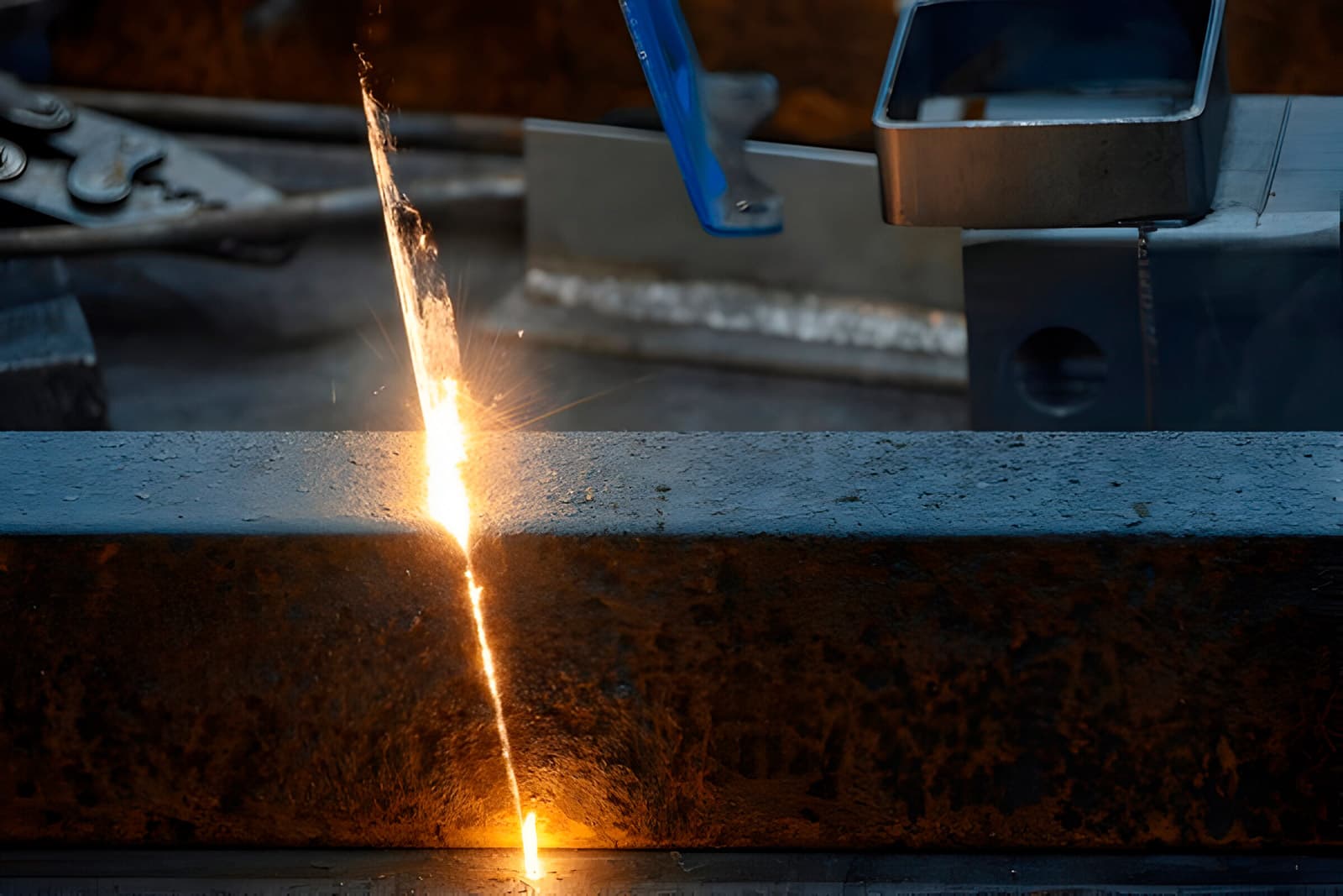 Laser cleaning pass removing rust from a steel beam